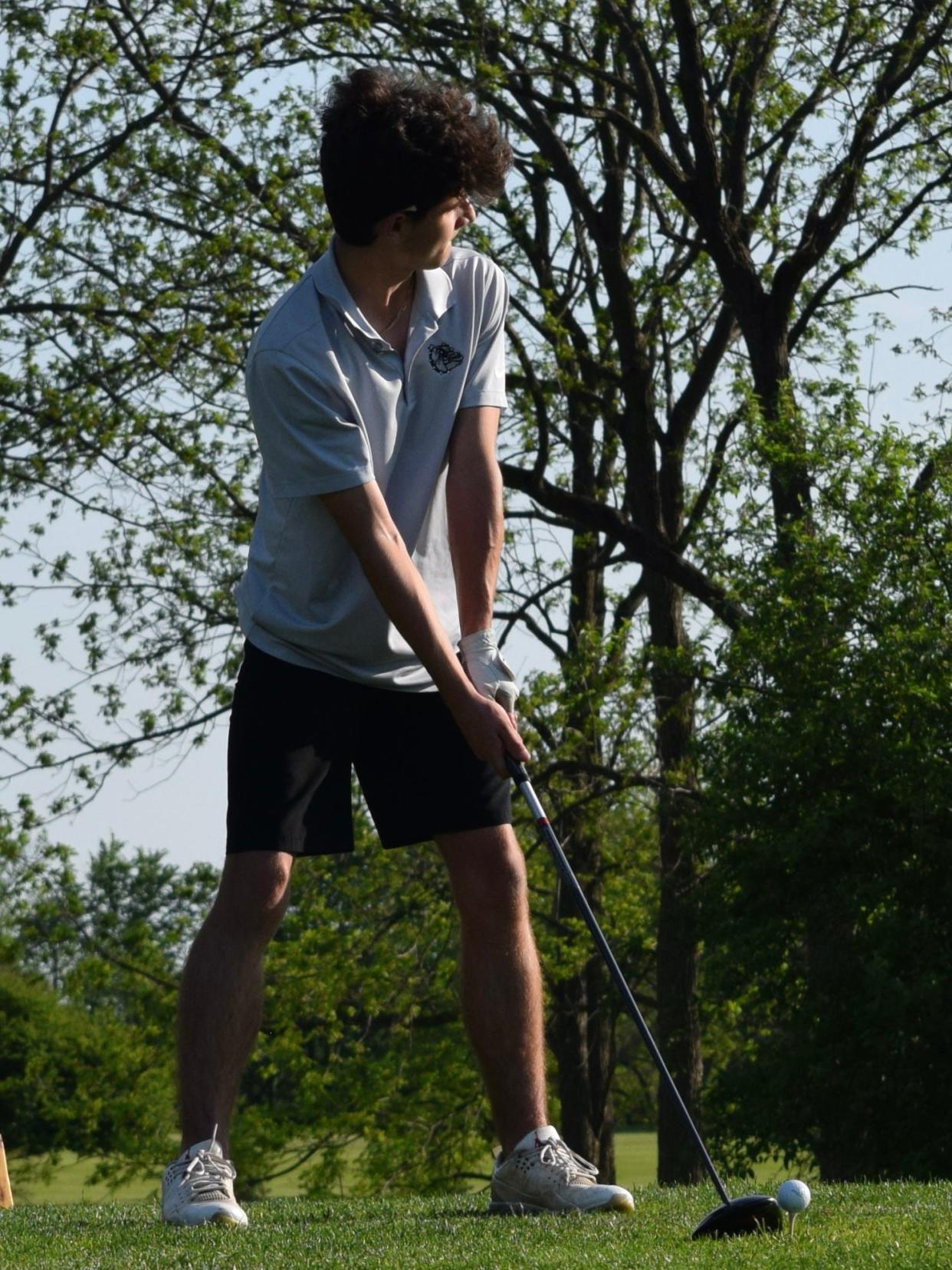 Monrovia junior Leyton Hausman looks down the course as he prepares to tee off a hole during the Bulldogs' dual match against Edgewood. (Seth Tow/Herald-Times)