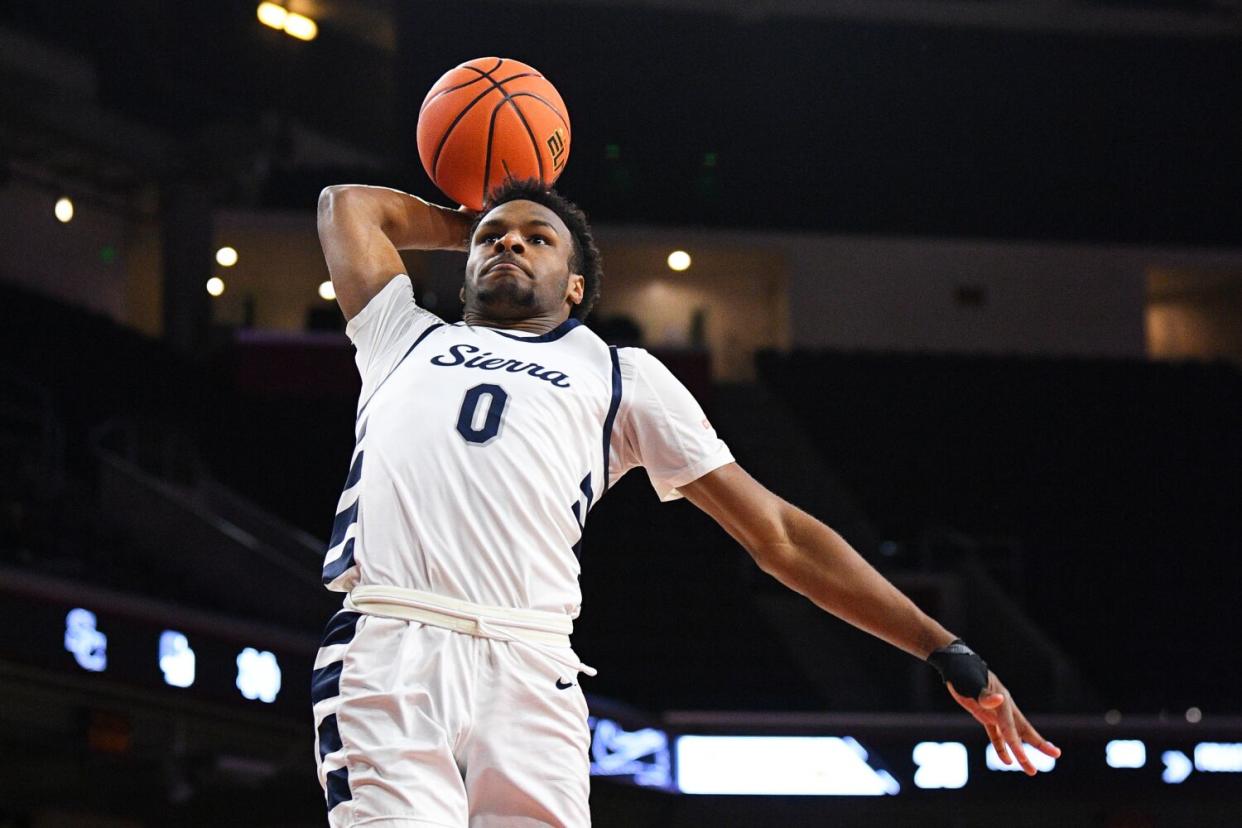 Sierra Canyon guard Bronny James elevates for a right-handed tomahawk dunk.