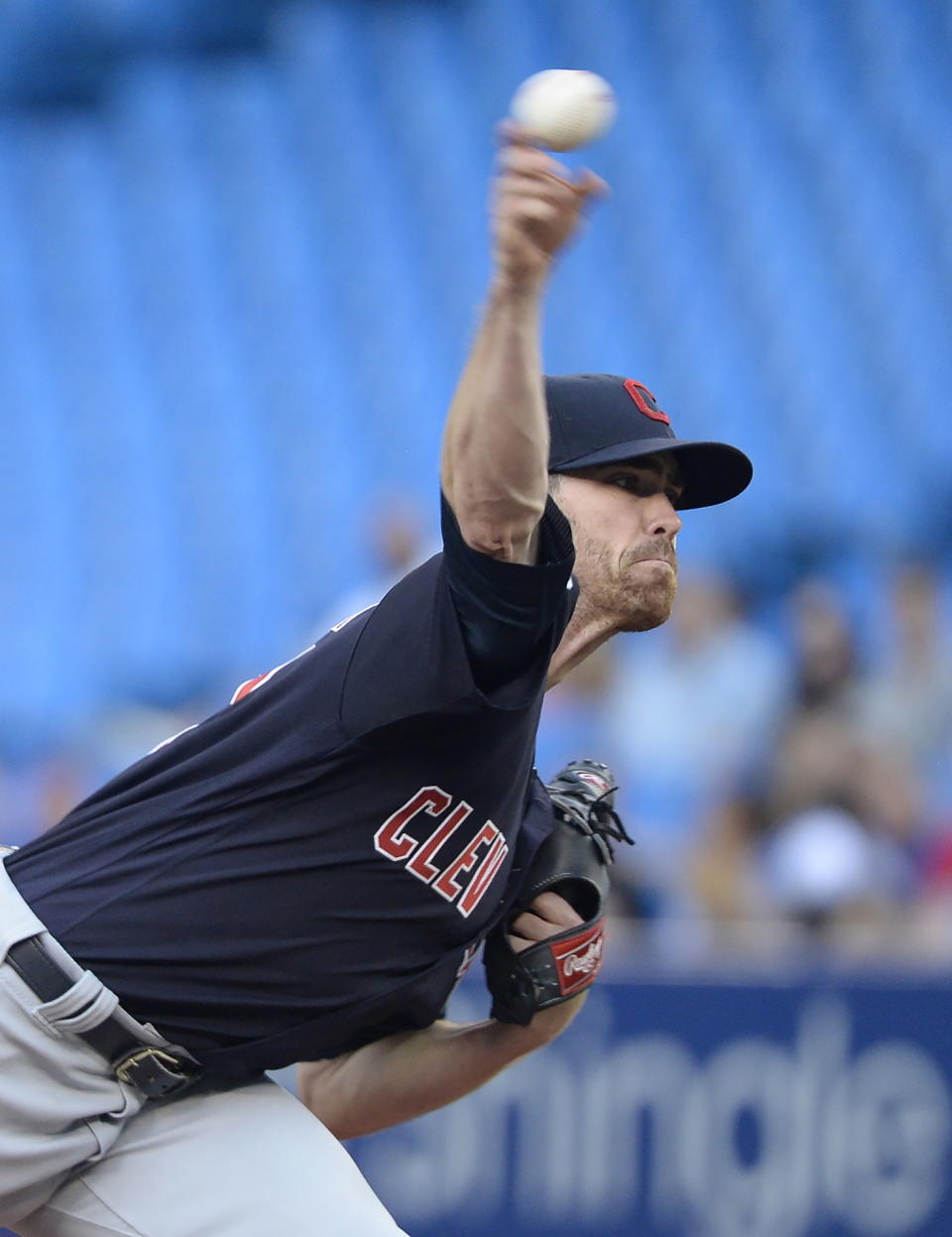 Cleveland Indians starting pitcher Shane Bieber (57) throws against the Toronto Blue Jays during the first inning of a baseball game, Wednesday, July 24, 2019 in Toronto. (Nathan Denette/Canadian Press via AP)