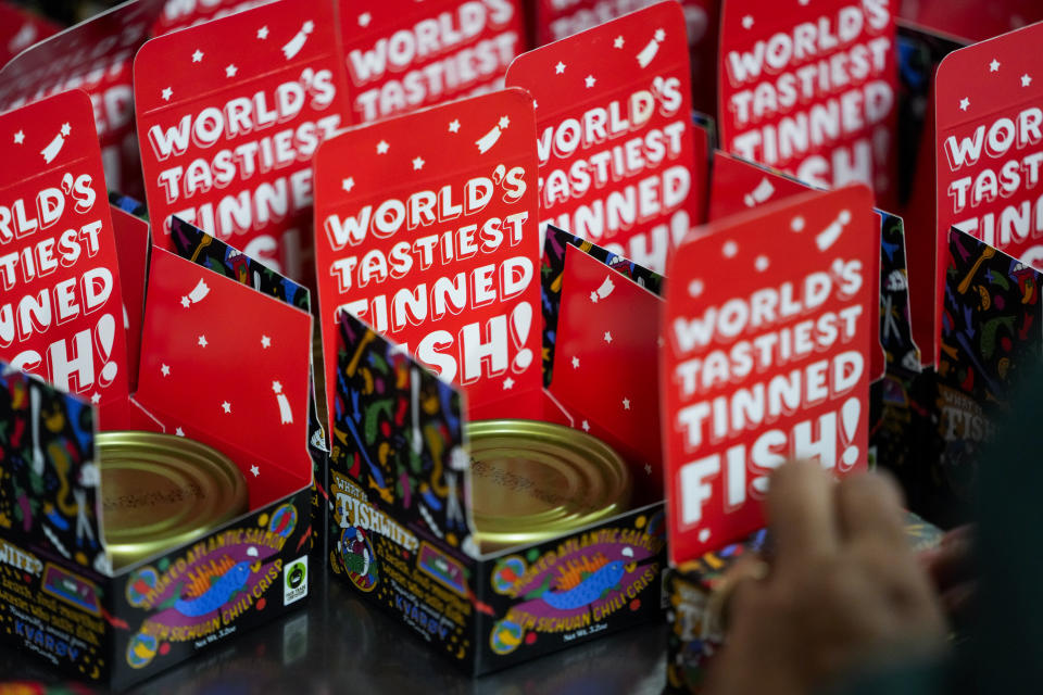 Smoked Atlantic salmon is placed into boxes for consumers at a cannery for Fishwife, a Los Angeles-based tinned fish company, Friday, Oct. 13, 2023, in Bay Center, Wash. (AP Photo/Lindsey Wasson)