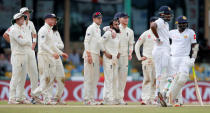 Cricket - England v Sri Lanka, Third Test - Colombo, Sri Lanka - November 24, 2018. England's Adil Rashid and captain Joe Root wait for a successful third umpire decision after taking the wicket of Sri Lanka's Malinda Pushpakumara. REUTERS/Dinuka Liyanawatte