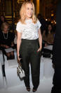 <p><strong>2 October</strong> Kylie Minogue kept it simple wearing a white logo tee and khaki trousers. </p>