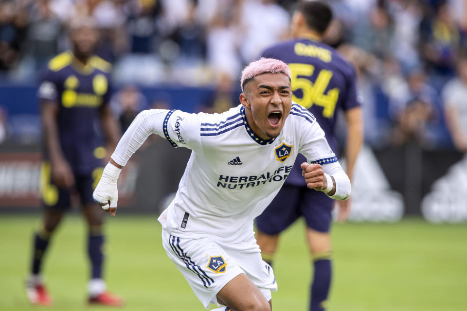 FILE- LA Galaxy defender Julian Araujo reacts after scoring a goal against Nashville SC during the second half of an MLS playoff soccer match, in Carson, Calif., on Oct. 15, 2022. Defender Julián Araujo was transferred Friday, Feb. 17, 2023, from the LA Galaxy to La Liga's FC Barcelona. (AP Photo/Alex Gallardo, File)