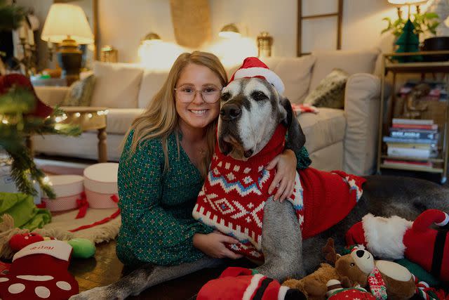 <p>Courtesy of Chewy</p> Riley the Great Dane with his owner Courtney Tucker, celebrating Christmas early