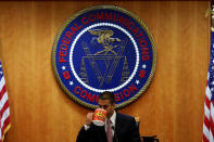 Chairman Ajit Paid drinks coffee ahead of the vote on the repeal of so called net neutrality rules at the Federal Communications Commission in Washington, U.S., December 14, 2017. REUTERS/Aaron P. Bernstein