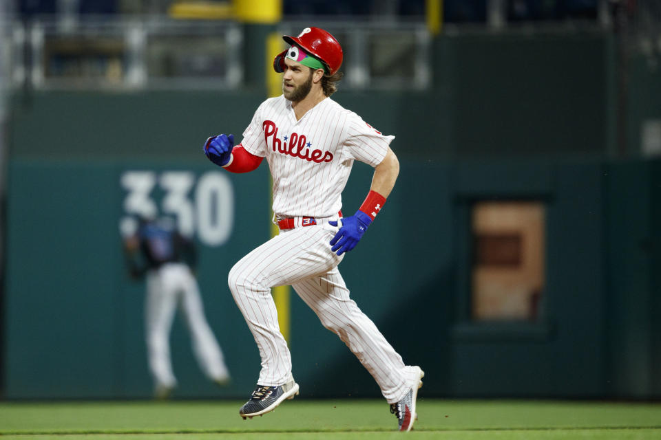 Philadelphia Phillies' Bryce Harper runs to second base after hitting a double off Miami Marlins starting pitcher Pablo Lopez during the third inning of a baseball game, Friday, Sept. 27, 2019, in Philadelphia. (AP Photo/Matt Slocum)