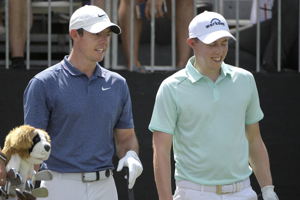 Rory McIlroy, left, of Northern Ireland, and Matthew Fitzpatrick, of England, share a laugh while waiting to his their tee shots on the first hole during the final round of the Arnold Palmer Invitational golf tournament Sunday, March 10, 2019, in Orlando, Fla. (AP Photo/Phelan M. Ebenhack)