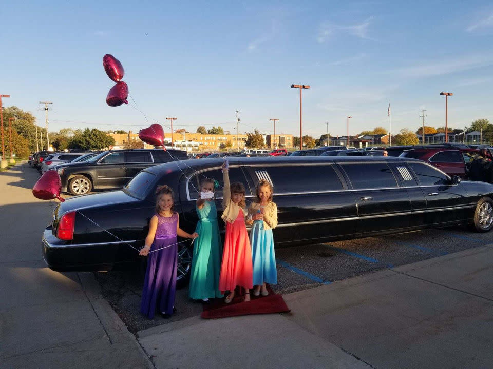 The girls standing in front of their surprise limo holding balloons in honor of Luke Reece. (Photo: Courtesy of Steve Culbert)