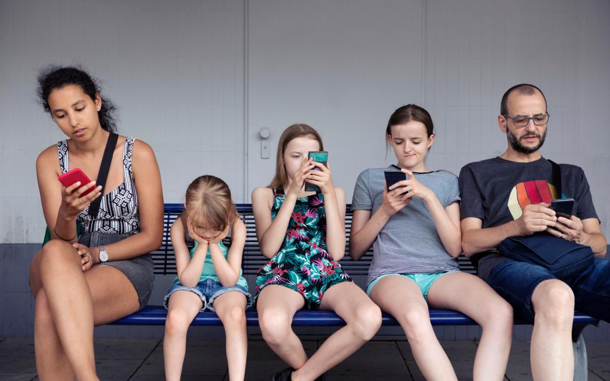 Children's mobile phone use often comes from seeing their parents, children's commissioner says