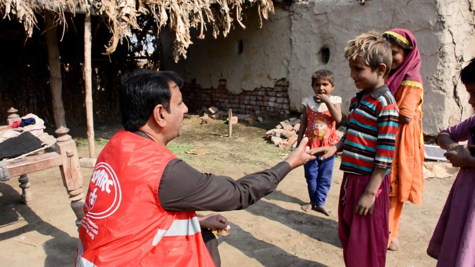 Volunteer meeting with children to fight child labor