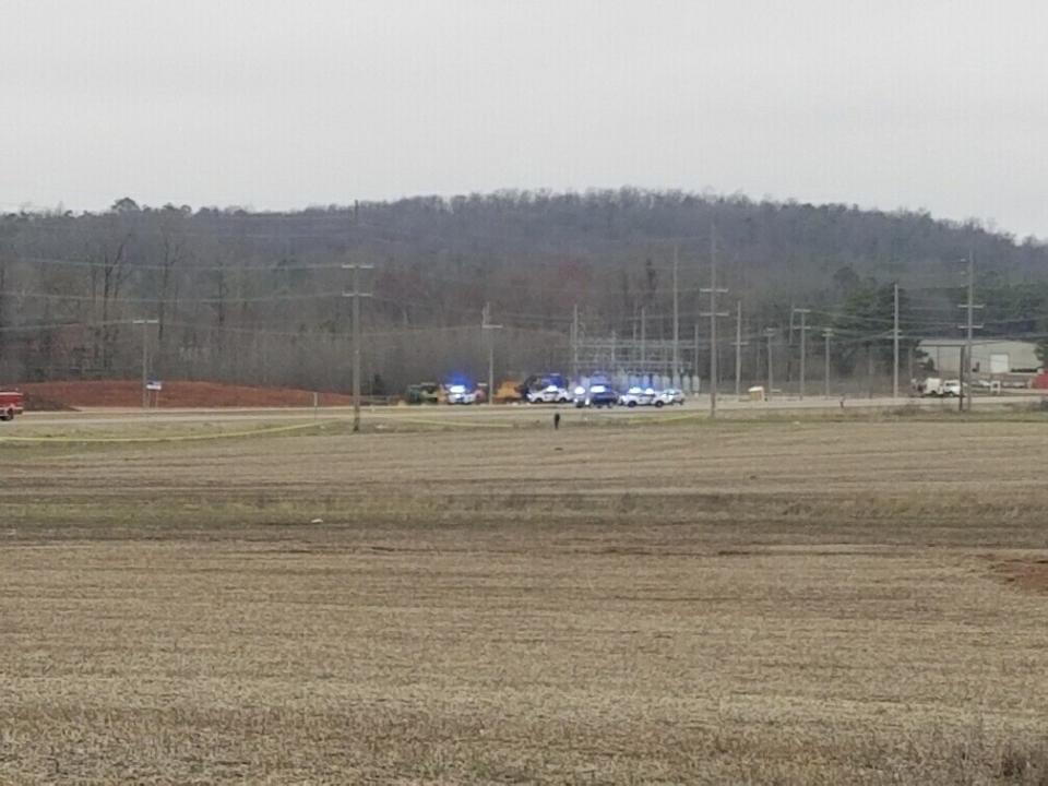 In this image provided by WHNT News 19, police respond to a Black Hawk helicopter crash Wednesday, Feb. 15, 2023, in the unincorporated community of Harvest, Ala. U.S. military officials say two people on board the helicopter, which was from the Tennessee National Guard, were killed. (Chris Frierson/WHNT News 19/Nexstar Media Group via AP)