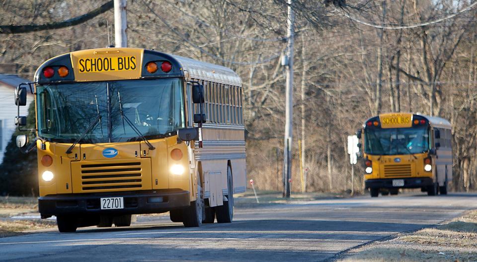 Ashland City School buses head down Edison Street to drop off students at Edison Elementary School a day last year. Provisions have been put into the new district handbook to assure safety on the buses.