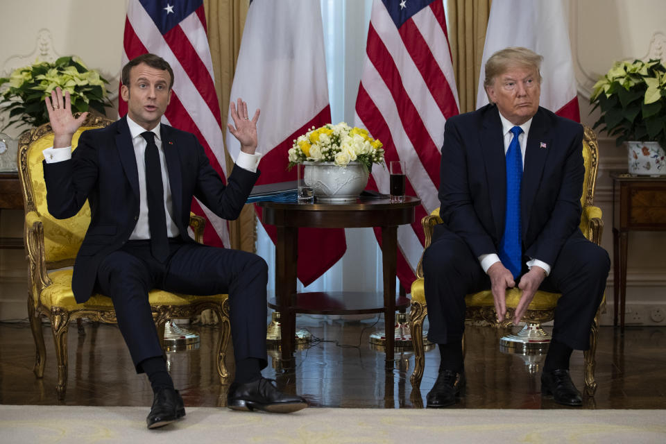 President Donald Trump listens as French President Emmanuel Macron speaks during a meeting at Winfield House during the NATO summit, Tuesday, Dec. 3, 2019, in London. (AP Photo/ Evan Vucci)