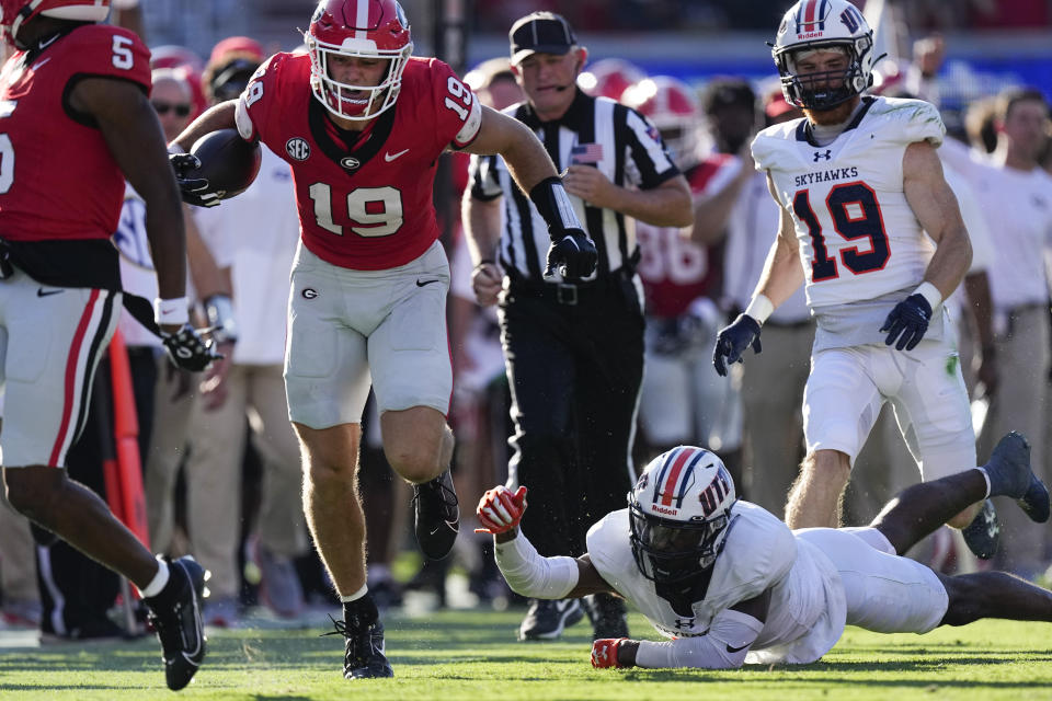 Georgia tight end Brock Bowers (19) gets past Tennessee-Martin defender after a catch during the first half of an NCAA college football game Saturday, Sept. 2, 2023, in Athens, Ga. (AP Photo/John Bazemore)