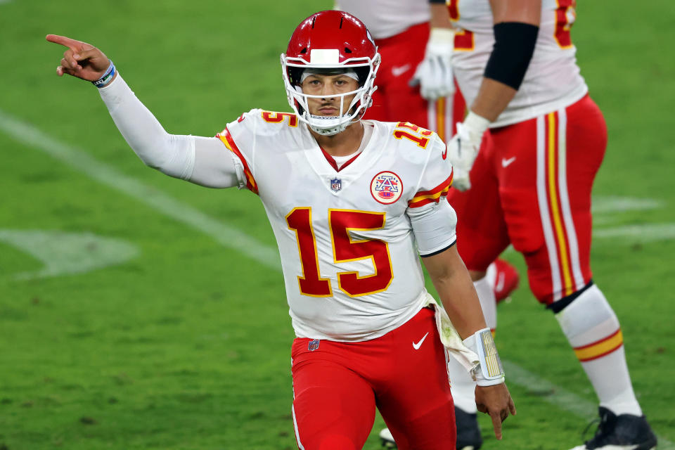 Patrick Mahomes motions during Monday's game.