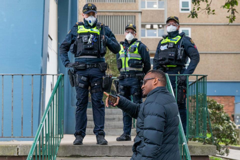 A man attempts to deliver groceries to family who live at the Flemington Public housing flats (Getty Images)