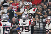 New England Patriots wide receiver Jakobi Meyers (16) is congratulated after a two-point conversion reception during the second half of an NFL football game between the New England Patriots and Las Vegas Raiders, Sunday, Dec. 18, 2022, in Las Vegas. (AP Photo/David Becker)