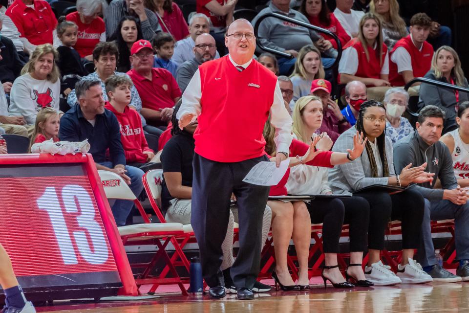Brian Giorgis looks on from the sideline while coaching the Marist College women's basketball team during a Feb. 2023 game.