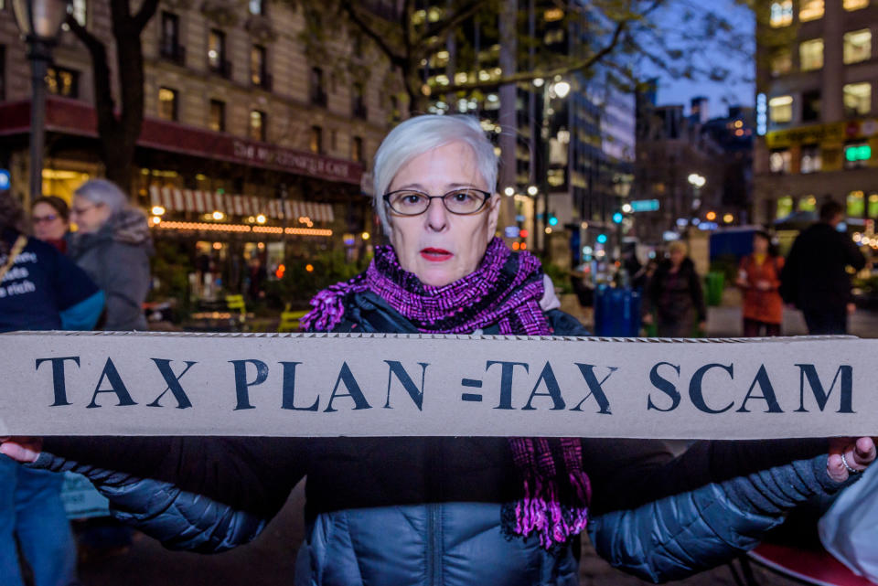 <p>Over a hundred protesters met at Greeley Square in Midtown Manhattan on Nov. 27, 2017 and marched along 34th Street behind a “Not One Penny of Tax Cuts for the Rich” banner, with “Tax Scam” signs, “Not One Penny” signs and giant checks made out from Medicaid or Medicare to billionaires or corporations, to raise awareness against the irresponsible tax plan that cuts Medicare and increases healthcare costs for older New Yorkers. (Photo: Erik Mcgregor/Pacific Press via ZUMA Wire) </p>