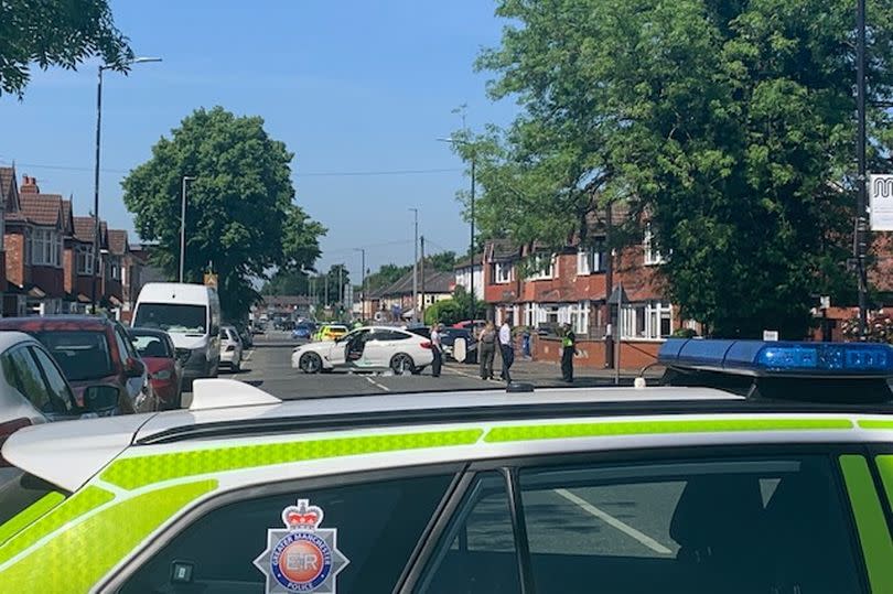 Police at the scene on Davyhulme Road East in Stretford