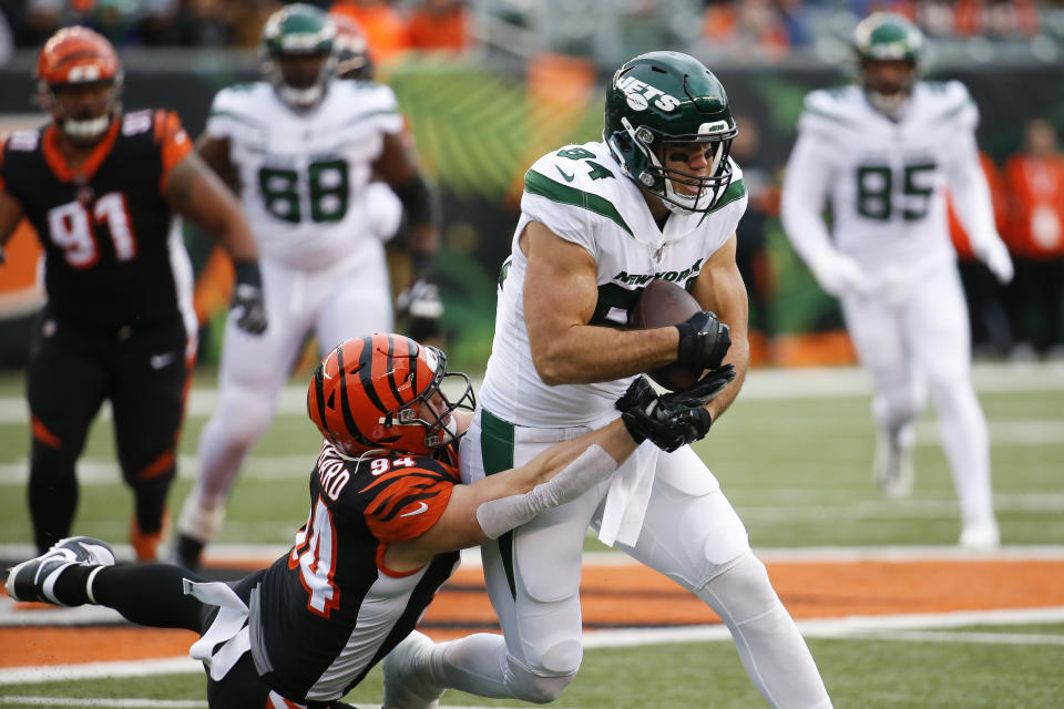 New York Jets tight end Ryan Griffin (84) runs the ball against Cincinnati Bengals defensive end Sam Hubbard (94) during the first half of an NFL football game, Sunday, Dec. 1, 2019, in Cincinnati. (AP Photo/Frank Victores)