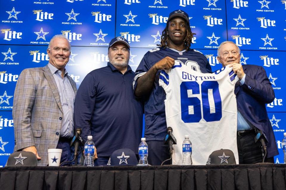 Dallas Cowboys Chief Operating Officer Stephen Jones, Head Coach Mike McCarthy and owner Jerry Jones take a photo with their first round pick Tyler Guyton during his introductory press conference at The Star in Frisco on Friday, April 26, 2024.