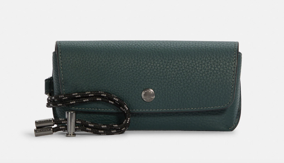 Sunglass Case in Gunmetal/Forest (Photo via Coach Outlet)