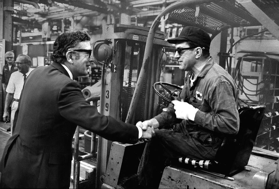 1975: United Auto Workers President Leonard Woodcock shaking hands with worker during tour of the Terex Division plant of General Motors in Hudson, Ohio. (Photo by Walter Bennett/The LIFE Picture Collection/Getty Images)