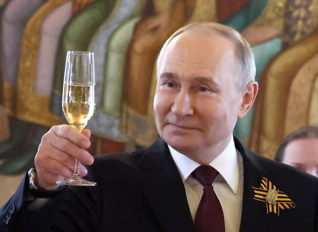 Russia's President Vladimir Putin celebrating on 