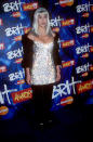 <p>In 1999, Cher made a splash at London’s BRIT Awards in a sparkly top and glittery wig. <i>[Photo: Rex]</i></p>