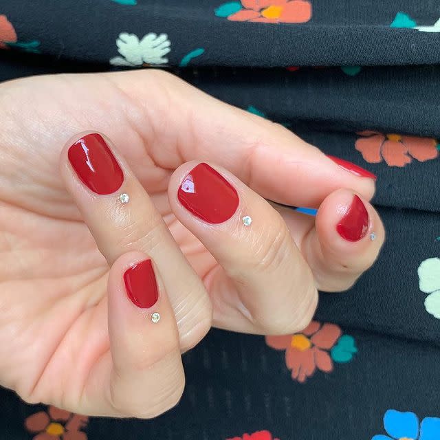 <p>Feeling extra glitzy? Secure a single rhinestone on your cuticle under a classic glossy red manicure. It probably won't survive the night, but it will make for one killer Instagram.</p><p><a href="https://www.instagram.com/p/BtJgPIJnrPi/" rel="nofollow noopener" target="_blank" data-ylk="slk:See the original post on Instagram;elm:context_link;itc:0;sec:content-canvas" class="link ">See the original post on Instagram</a></p>