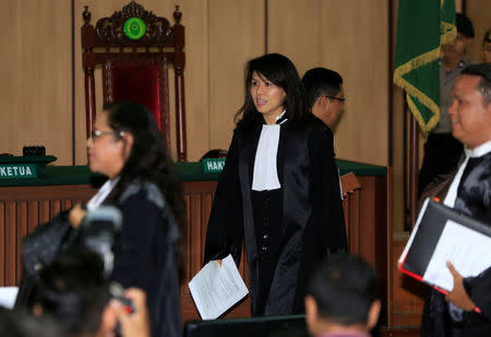 Fifi Lety Indra (C), lawyer of former Jakarta Governor Basuki Tjahaja Purnama walks before a trial at the North Jakarta District Court in Jakarta, Indonesia February 26, 2018. REUTERS/Beawiharta