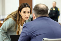 Assistant State Attorney Kristen Gomes confers with Assistant State Attorney Christopher Killoran during the trial of former Marjory Stoneman Douglas High School School Resource Officer Scot Peterson, Thursday, June 8, 2023, at the Broward County Courthouse in Fort Lauderdale, Fla. Peterson is charged with child neglect and other charges for failing to stop the Parkland school massacre five years ago. (Amy Beth Bennett/South Florida Sun-Sentinel via AP, Pool)