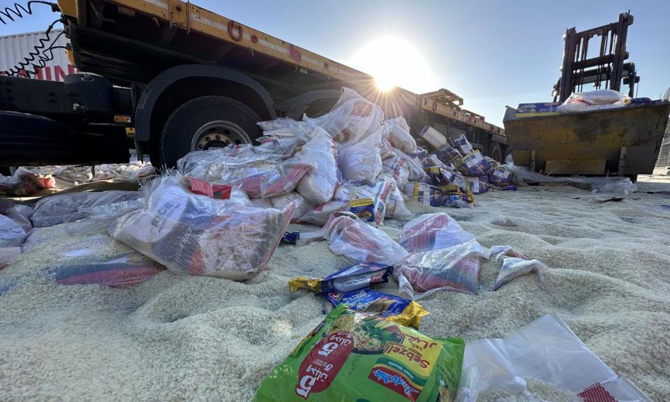 <span>Humanitarian aid supplies dumped by Jewish settlers on a road near Tarqumiyah military checkpoint near Hebron, West Bank.</span><span>Photograph: Anadolu/Getty Images</span>