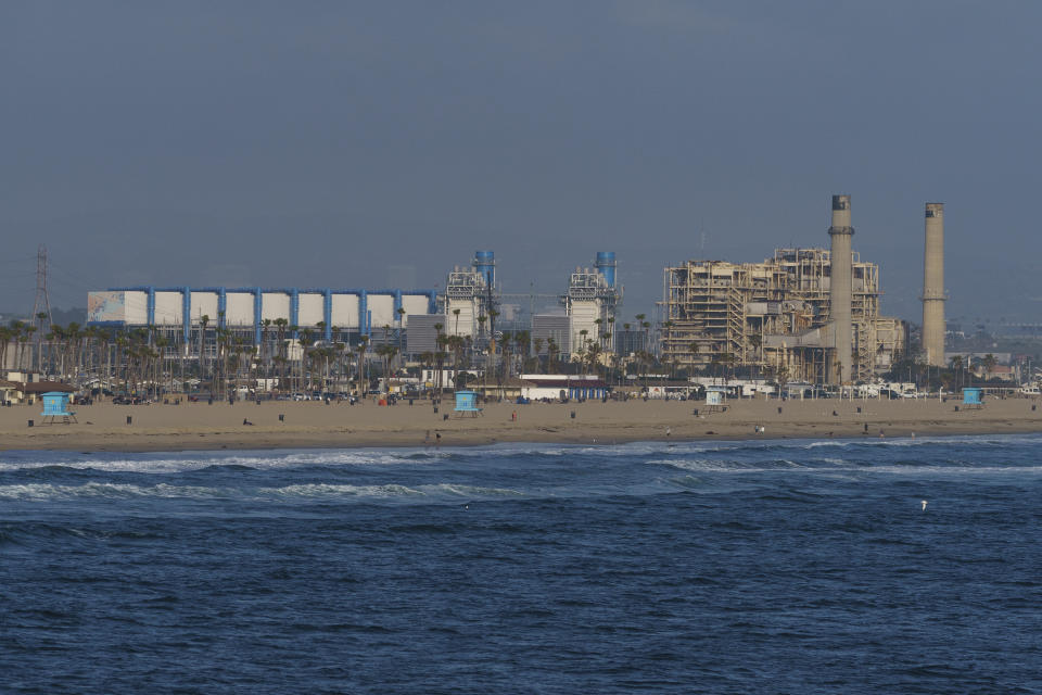 This May 2, 2022, photo shows the AES Huntington Beach Energy Center in Huntington Beach, Calif. The AES facility, the proposed site of the Poseidon Huntington Beach Seawater Desalination Plant will face a critical vote by the California Coastal Commission (CCC) on Thursday, May 12. The highly contested project has been debated for more than two decades. (AP Photo/Damian Dovarganes)