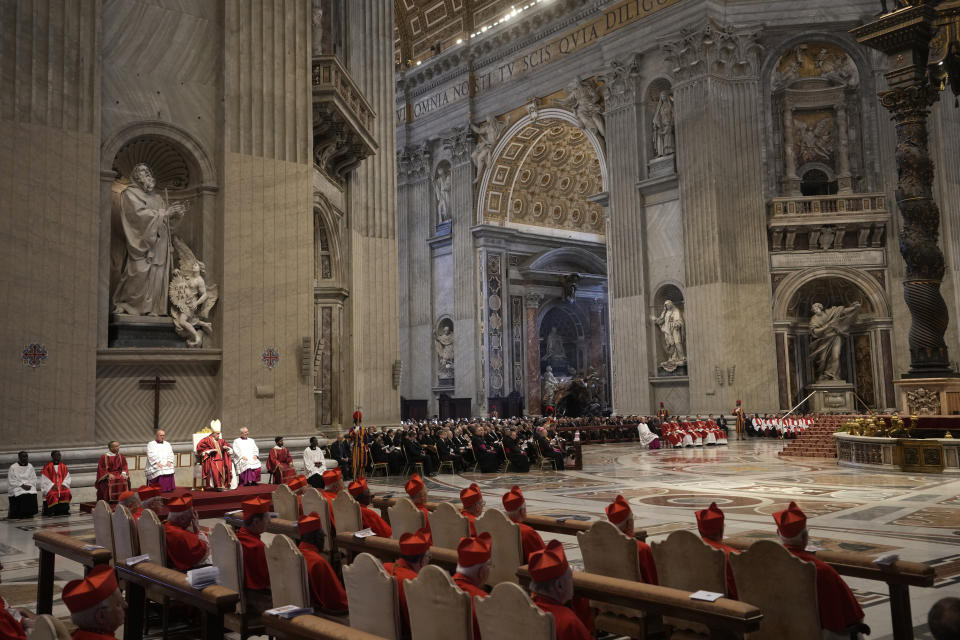 Pope Francis celebrates the Passion Mass on Good Friday, inside St. Peter's Basilica, at the Vatican, Friday, April 7, 2023. (AP Photo/Andrew Medichini)