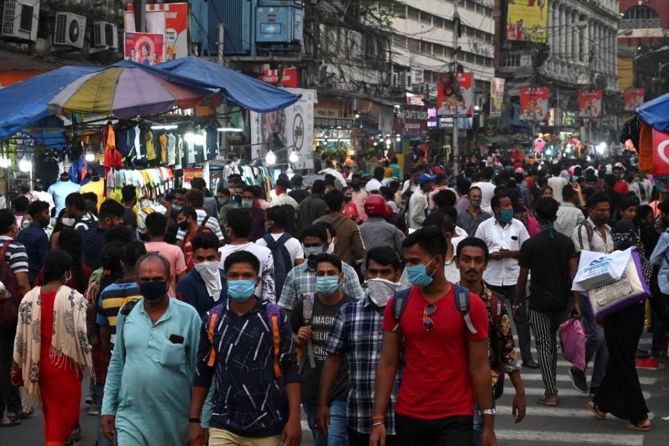 People gather in a market ahead of the Hindu festival ‘Durga Puja’ in Kolkata (AFP via Getty Images)