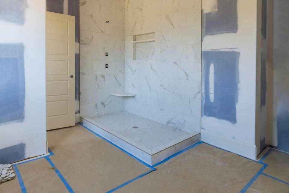 An incomplete bathroom is in the process of being remodeled. 