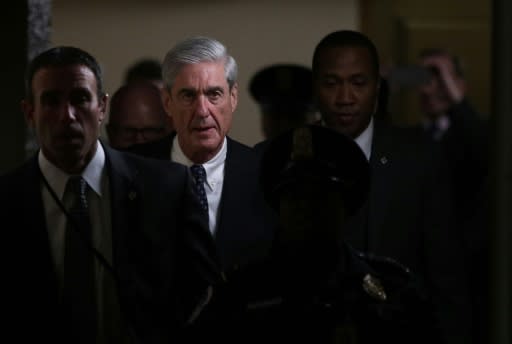 Special Counsel Robert Mueller (2nd L) worked quickly on one of the most disturbing investigations in US history: did President Donald Trump and his campaign collude with Russia?