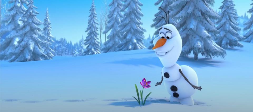 PHOTO: In this still from the teaser for Disney's 'Frozen,' Olaf is seen looking at a flower in the snow.  (Walt Disney Animation Studios)