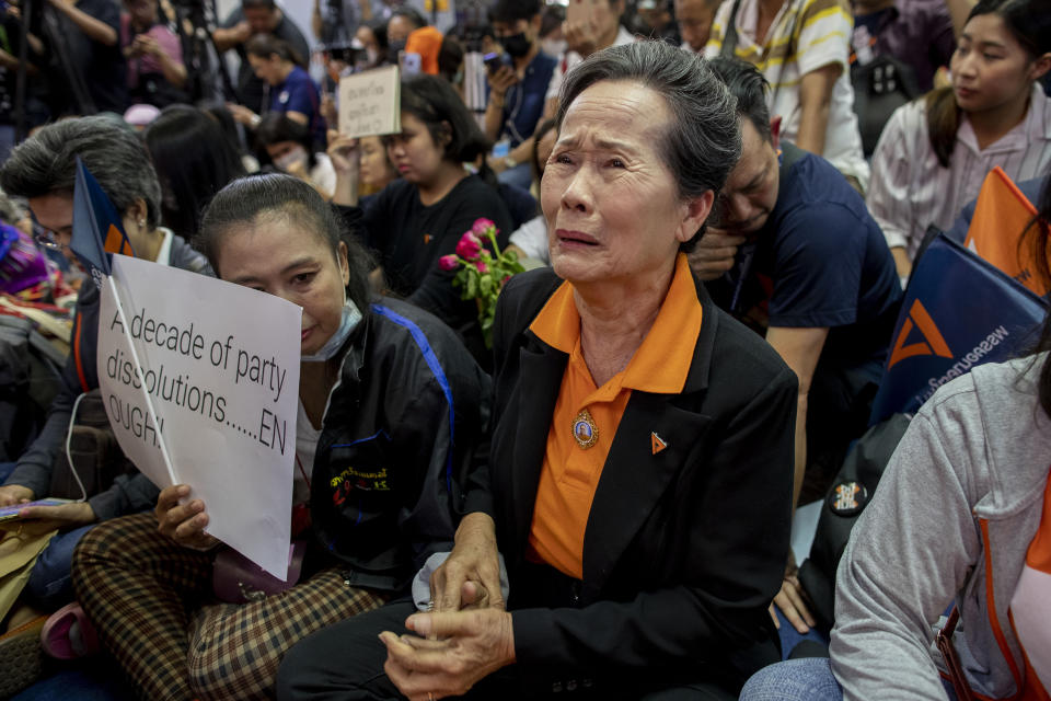 A supporter of Thailand's Future Forward Party cries as they watch a live television broadcast of a court verdict at their party's headquarters in Bangkok, Thailand, Friday, Feb. 21, 2020. Thailand's Constitutional Court on Friday ordered the popular opposition Future Forward Party dissolved, declaring that it violated election law by accepting a loan from its leader. The court also imposed a 10-year ban on the party's executive members holding political office. (AP Photo/Gemunu Amarasinghe)