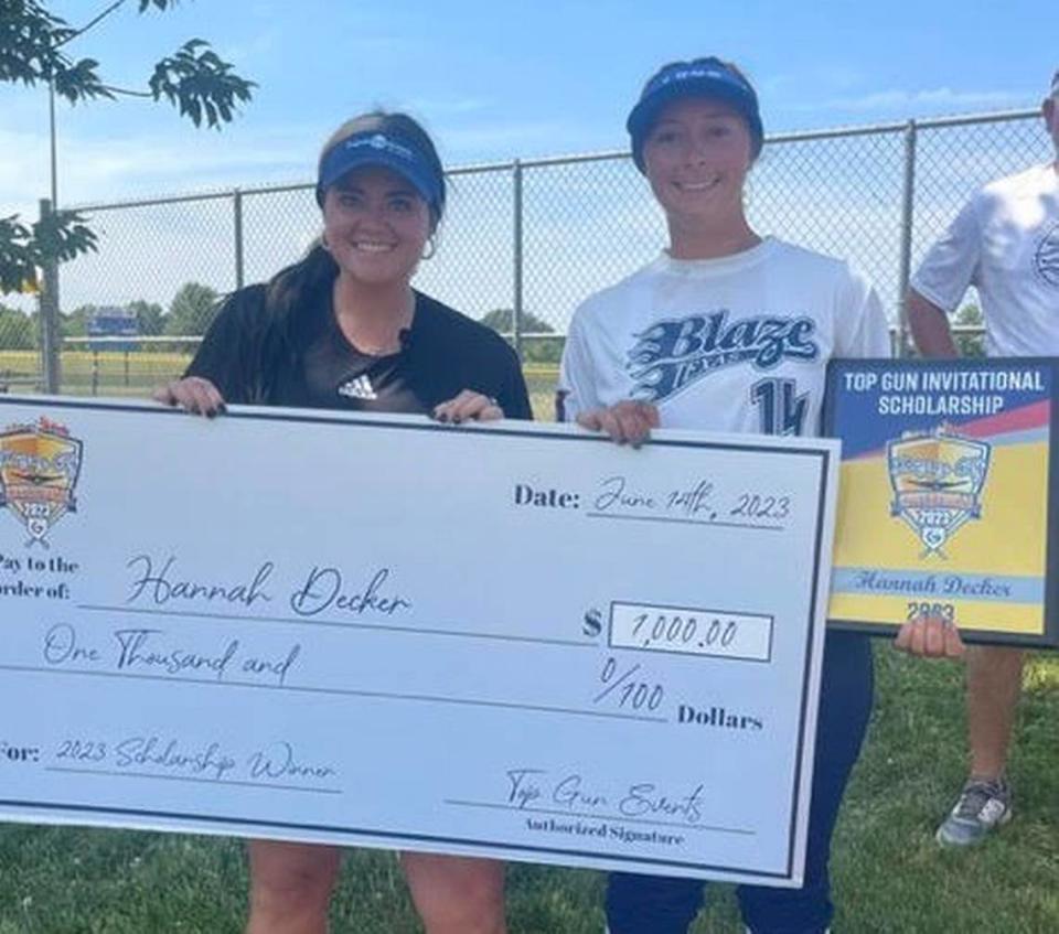Scholarship winner Hannah Decker of Texas Blaze NTX 18u National-Ward poses with Top Gun Events Director of Operations Kayleigh Behymer during the 2023 invitational in Kansas City.
