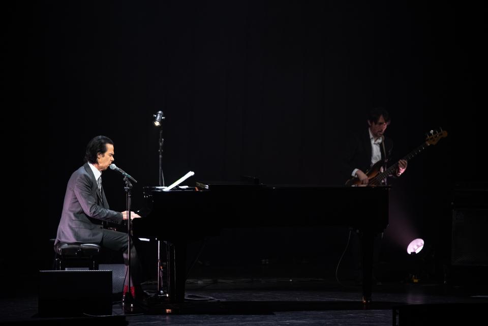 Nick Cave, with Radiohead's Colin Greenwood on bass, performs at the Riverside Theater in Milwaukee on Wednesday, Sept. 27, 2023.