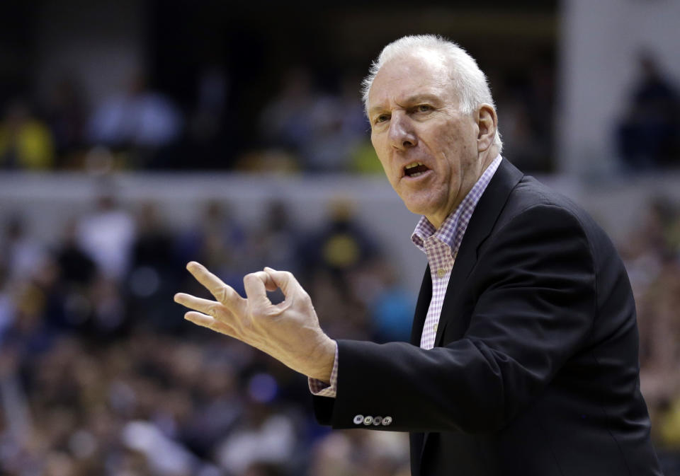 San Antonio Spurs head coach Gregg Popovich looks for a three second call in the first half of an NBA basketball game against the Indiana Pacers in Indianapolis, Monday, March 31, 2014. (AP Photo/Michael Conroy)