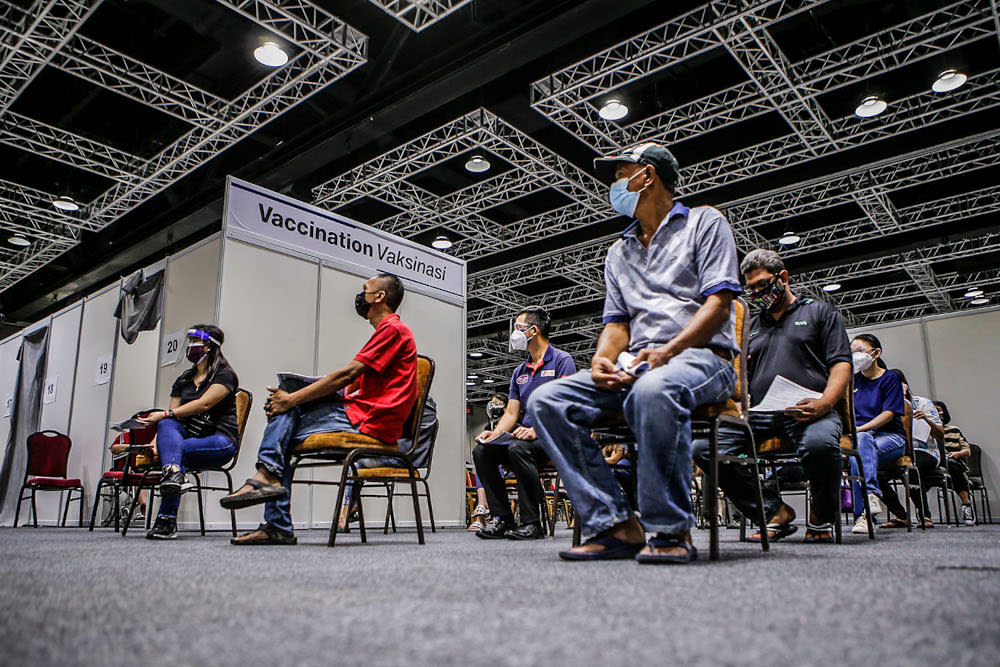 Walk-in recipients wait to get their Covid-19 vaccine injection at the Kuala Lumpur Convention Centre vaccination centre, August 2, 2021. ― Picture by Hari Anggara