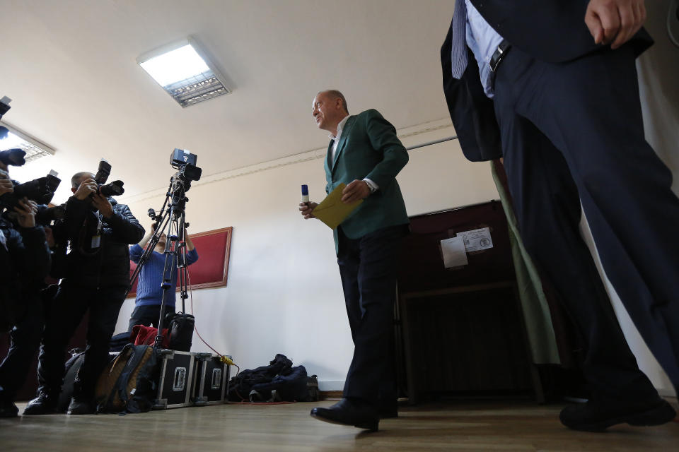 Turkey's President Recep Tayyip Erdogan, casts his ballot during local elections, in Istanbul, Sunday, March 31, 2019. Turkish citizens have begun casting votes in municipal elections for mayors, local assembly representatives and neighbourhood or village administrators that are seen as a barometer of Erdogan's popularity amid a sharp economic downturn.(AP Photo/Lefteris Pitarakis)