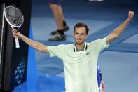 Daniil Medvedev of Russia celebrates after defeating Felix Auger-Aliassime of Canada in their quarterfinal match at the Australian Open tennis championships in Melbourne, Australia, early Thursday, Jan. 27, 2022. (AP Photo/Hamish Blair)