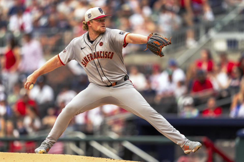 San Francisco Giants pitcher Logan Webb throws during the first inning of a baseball game against the Atlanta Braves, Thursday, July 4, 2024, in Atlanta. (AP Photo/Jason Allen)