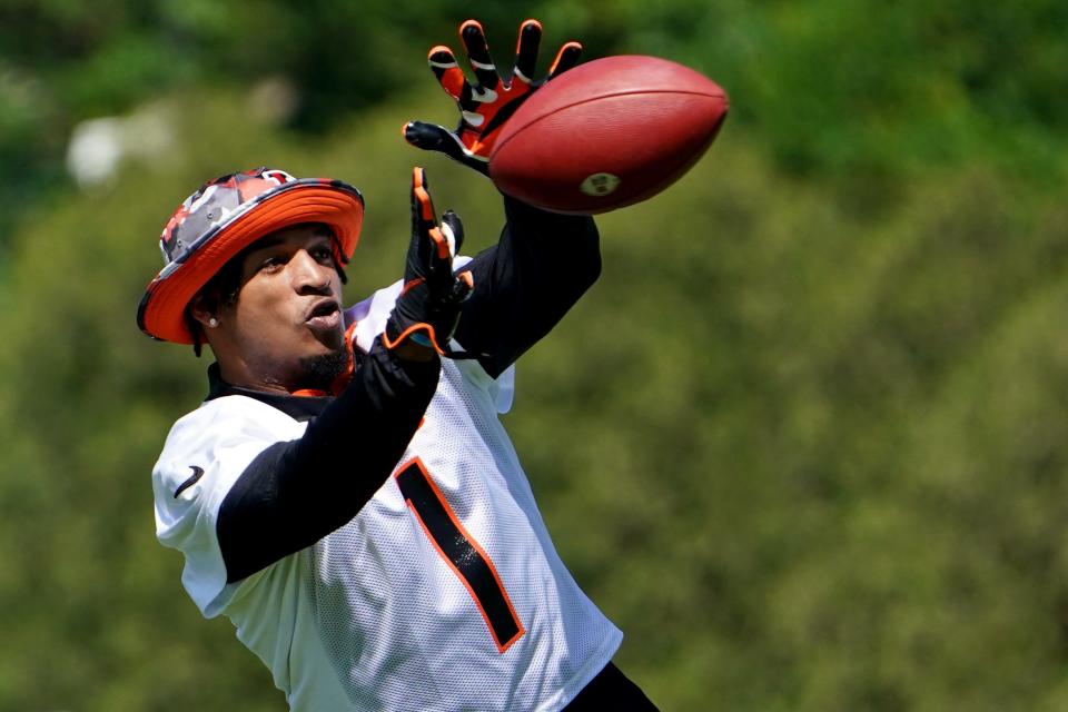 Cincinnati Bengals wide receiver Ja'Marr Chase (1) catches a pass during practice, Tuesday, May 17, 2022, at the Paul Brown Stadium practice fields in Cincinnati.