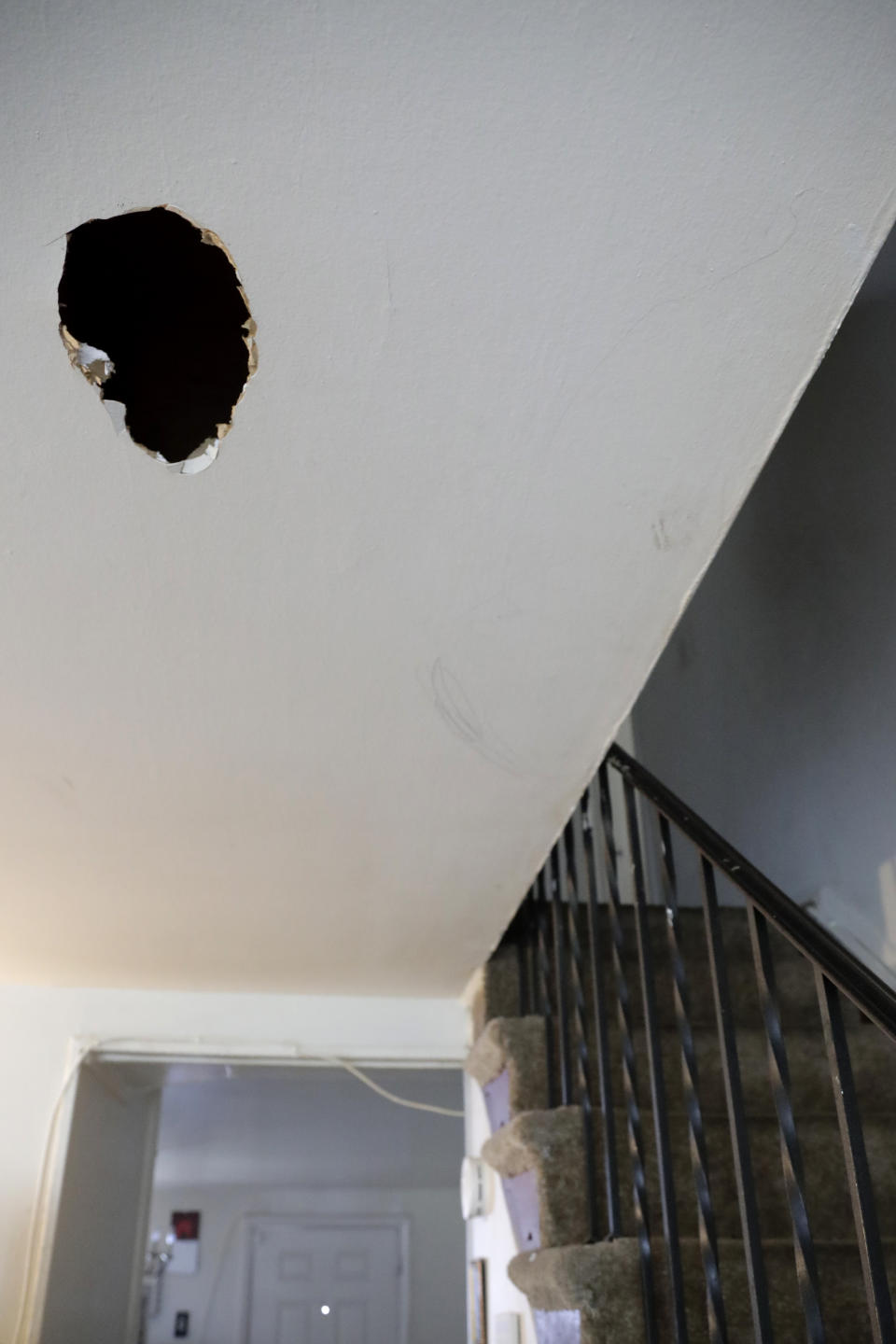 A hole is seen on the ceiling of the first floor of Carrie Newson's residence at the Dutch Village apartments, Tuesday, July 30, 2019, in Baltimore. Newson has complained to management about mice and mold in her home but the issues have yet to be fixed. The apartment complex is owned by Jared Kushner, son-in-law of President Donald Trump. (AP Photo/Julio Cortez)